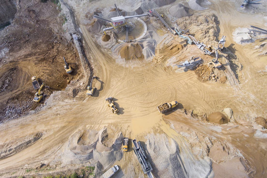 A UAV monitors an open-pit mine from above